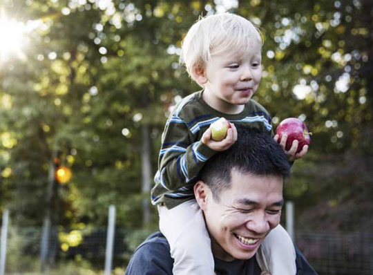 Father with son on his shoulders
